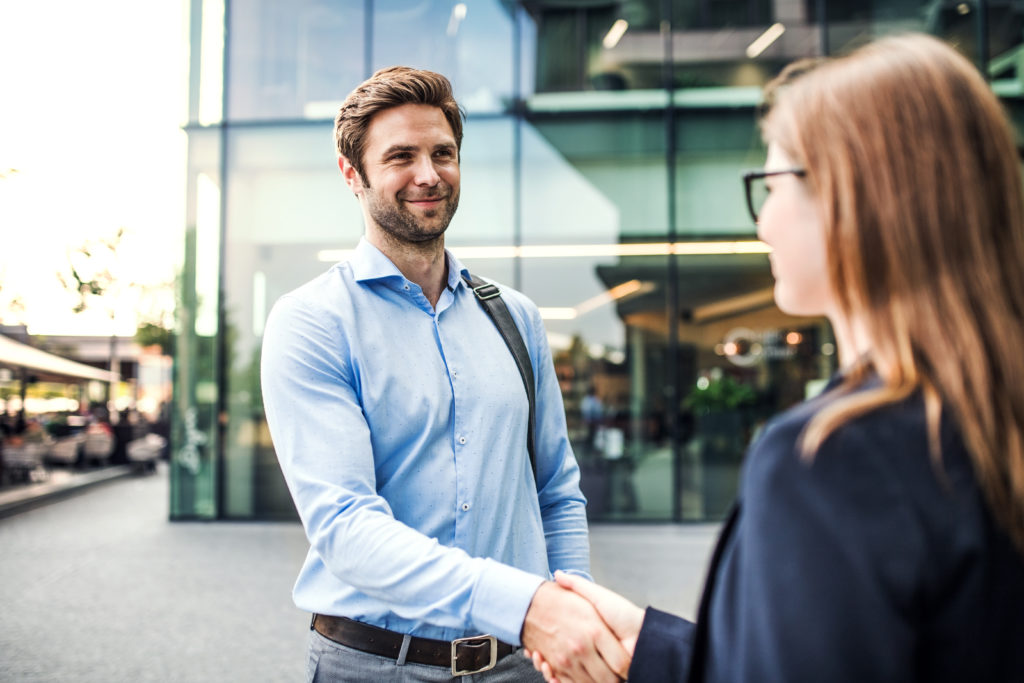 A Young Businessman And Businesswoman Shaking Hand 2021 08 26 12 08 56 Utc